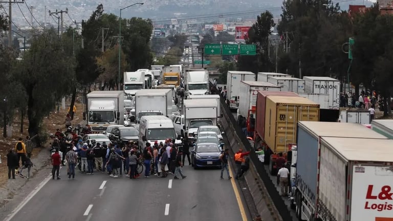 Aerial view of a highway blocked by trucks